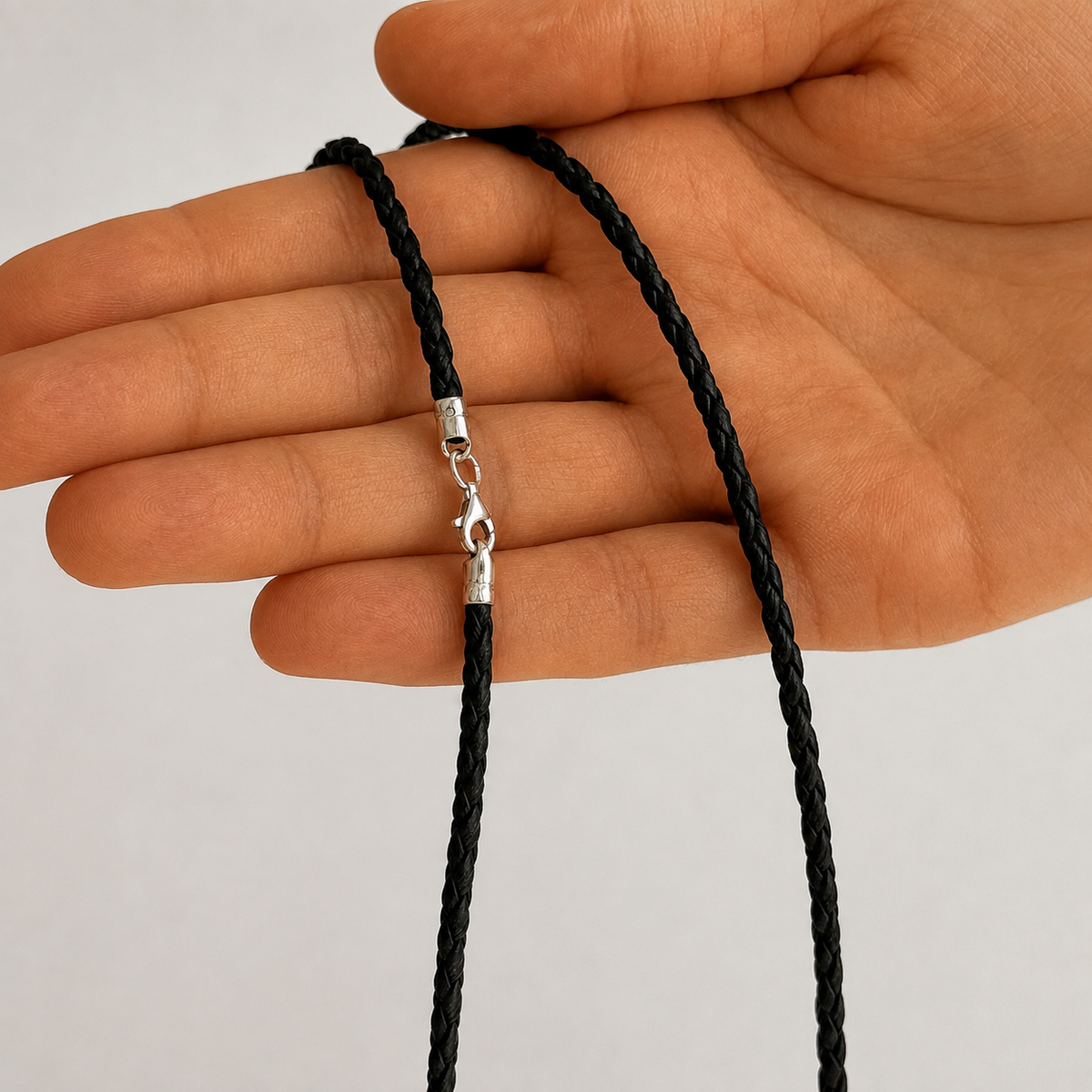 Braided leather cord with a 925 sterling silver clasp 6010/3,0